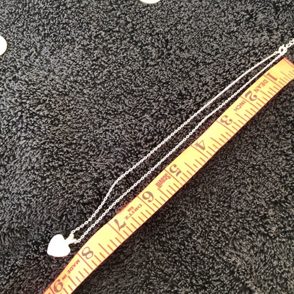 Heart bling dime size w/solid back with slight rub marks on back. Silver color. - Picture 7 of 15